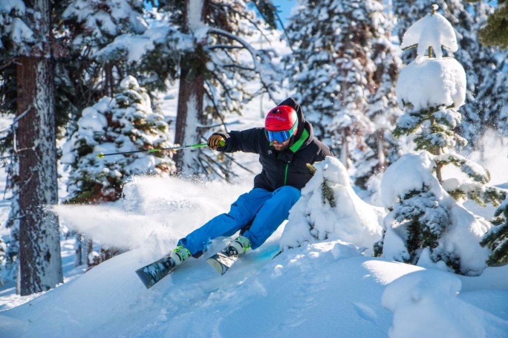 Skier turning in powder snow